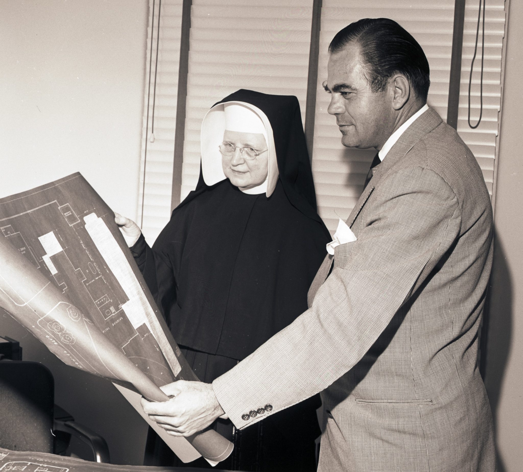 Looking at plans for North Wing, 1948Bill Beebe Collection (3.2.5746)