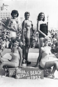 Miss Muscle Beach 1952 Winners of Miss Muscle Beach 1952 standing on platform with their trophies