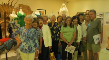 Volunteer docent giving group tour of Museum