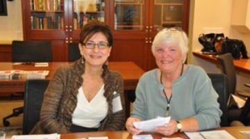 Volunteers greet guests at a Museum event