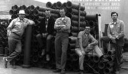 Bourget Brothers standing at their business