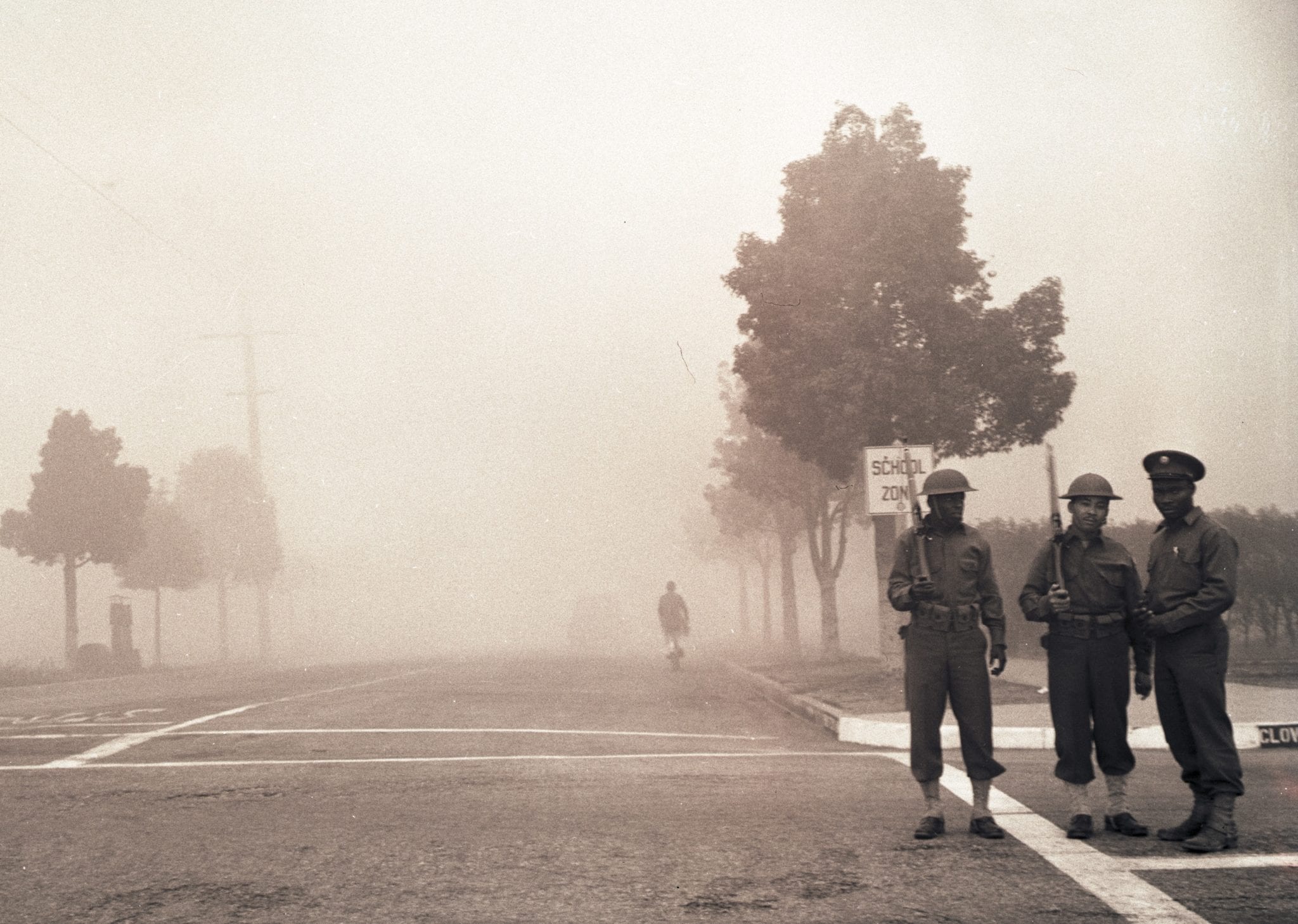 The Fourth Fighter Command conducts a smoke defense test in Santa Monica during World War II. Two soldiers stand at the intersection of Cloverfield Boulevard and Pearl Street.Bill Beebe Collection (3.2.6480)