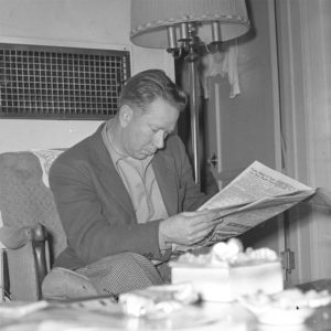 Emerson Gaze reading the newspaper