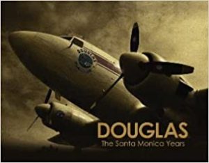 Book cover for: Douglas - The Santa Monica Years. Airplane and dark sky