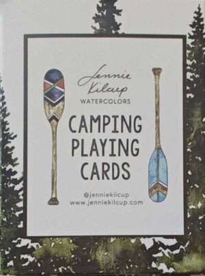 front side of deck of cards box - drawing of paddles, redwood trees in background
