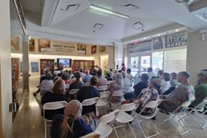 Book Talk with Nina Fresco - First Around the World Nina Fresco talking about her book First Around the World at the Santa Monica History Museum, with audience in foreground