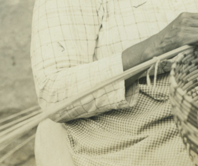 Person weaving a basket