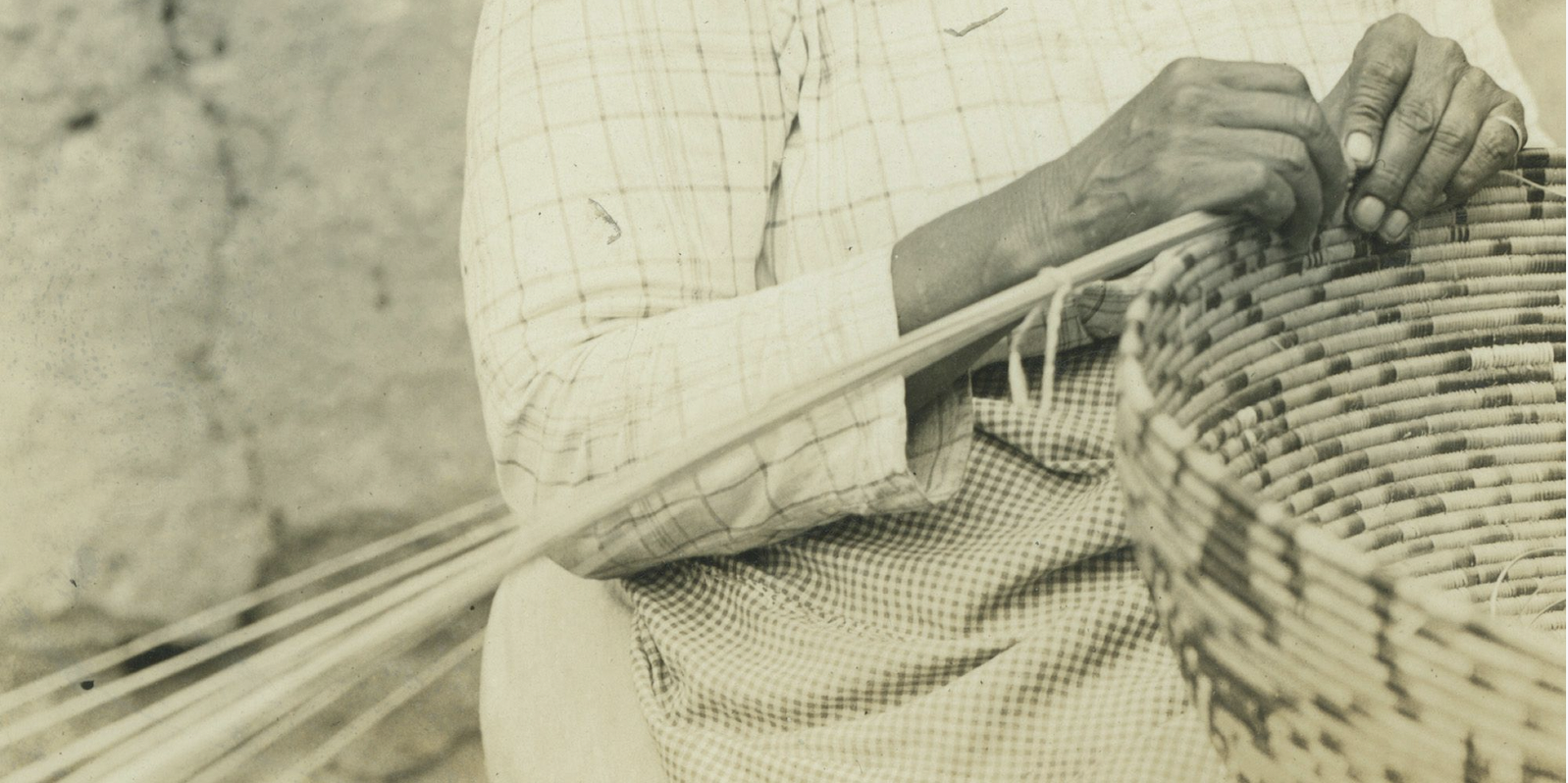 Person weaving a basket